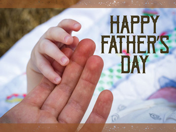 Church Newsletter Photo of child's and father's hand with Happy Father's Day caption